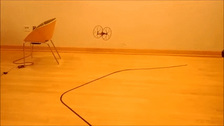 Rolling Spider micro-drone executing closed-loop visual path tracking along yellow floor-marked trajectories. | Watch Full Video Demonstration on YouTube ↗ | https://www.youtube.com/watch?v=f5l8GA1PHm8#no-embed